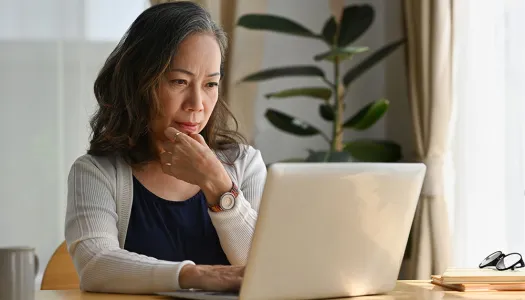 concerned looking woman on computer